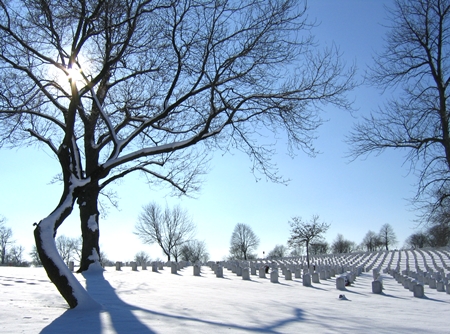 Snow covers headstones at Wood National Cemetery.