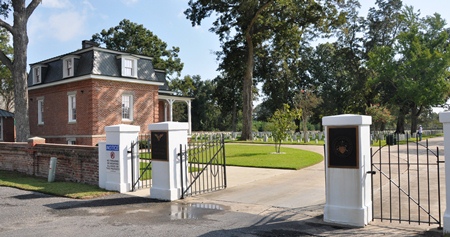 Entrance gate and lodge at Port Hudson National Cemetery. Entrance gate and lodge at Port Hudson National Cemetery.