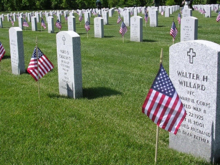 Headstones decorated for Memorial Day at Ohio Western Reserve National Cemetery.