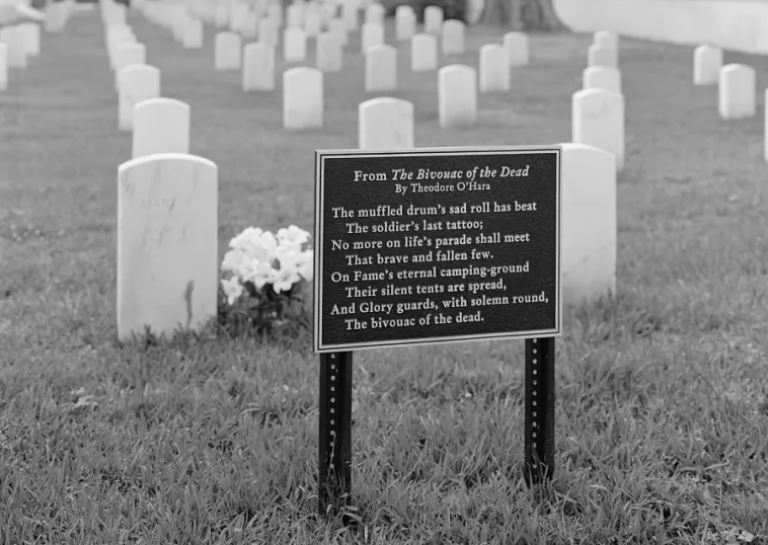 Tablet at Mobile National Cemetery inscribed with the opening stanza of the 1850 poem 'Bivouac of the Dead' by Theodore O'Hara. The plaque bearing O'Hara's timeless lament to soldiers lost in battle has been installed at national cemeteries throughout the VA system. (Library of Congress)