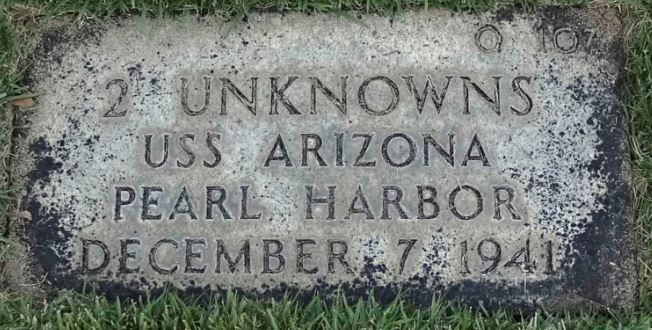 A grave marker that reads Q107, 2 unknowns, USS Arizona, Pearl Harbor, December 7 1941.