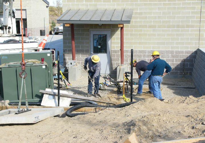 Picture of a workcrew installing electrical lines.